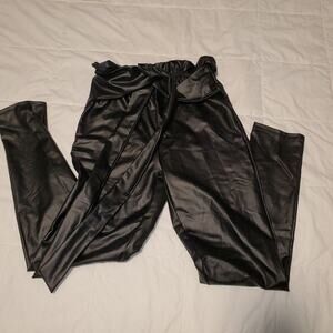 Day and night faux leather leggings. size tag is missing measurements included